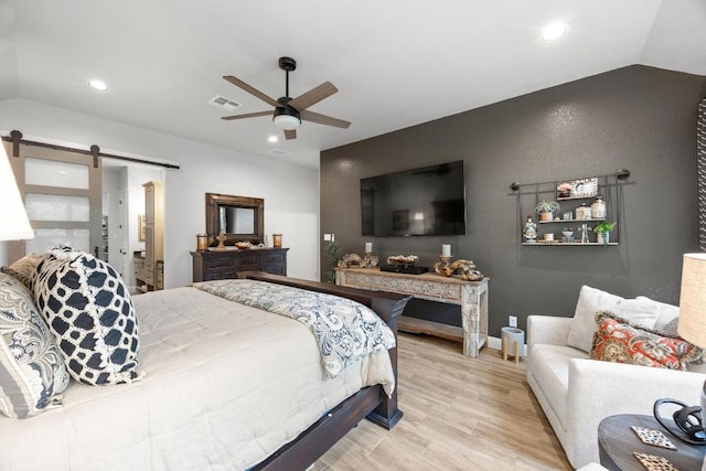 741 Faith Dr, Liberty Hill, TX 78642 - bedroom with lofted ceiling, a barn door, recessed lighting, ceiling fan, and baseboards