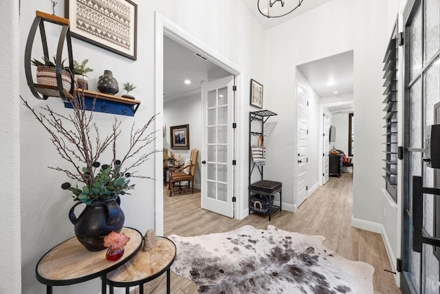 741 Faith Dr, Liberty Hill, TX 78642 - foyer with french doors, wood finished floors, baseboards, and recessed lighting