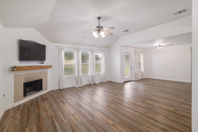 3339 Alexander Valley Cv, Round Rock, TX 78665 - unfurnished living room with vaulted ceiling, ceiling fan, wood finished floors, and a fireplace