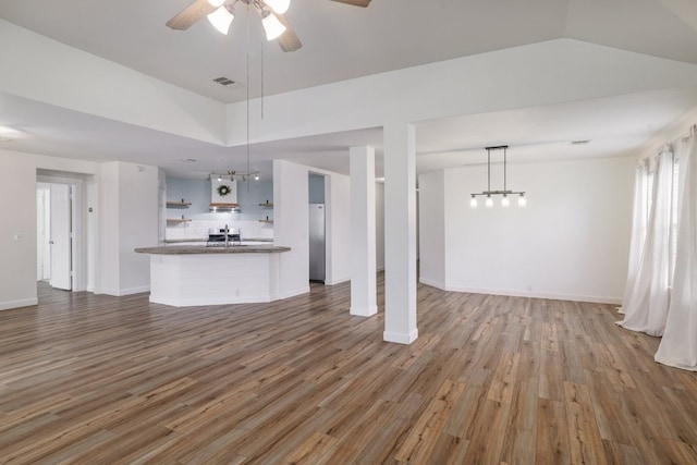 3339 Alexander Valley Cv, Round Rock, TX 78665 - unfurnished living room featuring ceiling fan, wood finished floors, and lofted ceiling