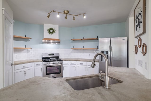 3339 Alexander Valley Cv, Round Rock, TX 78665 - kitchen featuring appliances with stainless steel finishes, open shelves, range hood, and white cabinets