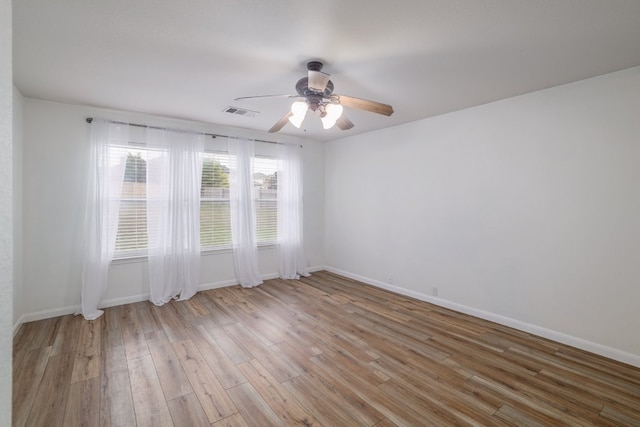 3339 Alexander Valley Cv, Round Rock, TX 78665 - empty room with a ceiling fan and wood finished floors