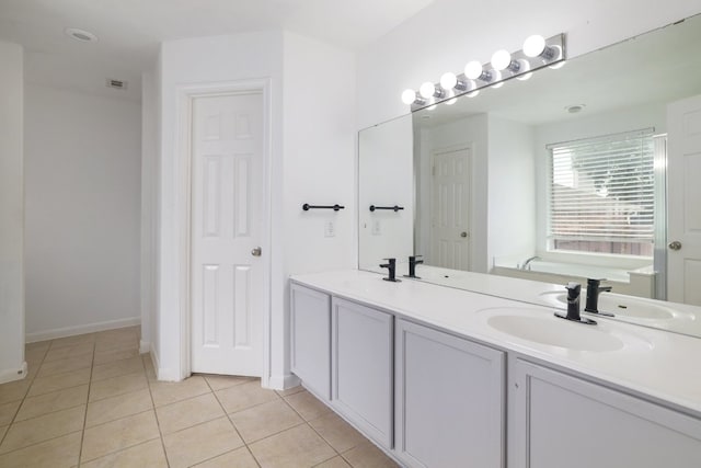 3339 Alexander Valley Cv, Round Rock, TX 78665 - bathroom with tile patterned flooring, a garden tub, and double vanity