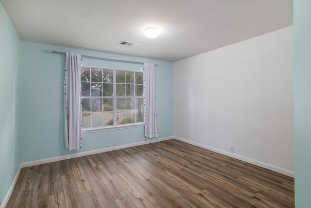 3339 Alexander Valley Cv, Round Rock, TX 78665 - unfurnished room with wood finished floors and baseboards