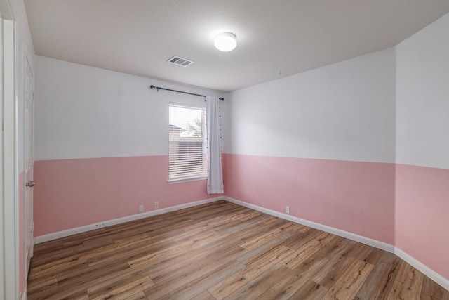3339 Alexander Valley Cv, Round Rock, TX 78665 - spare room featuring wood finished floors and baseboards