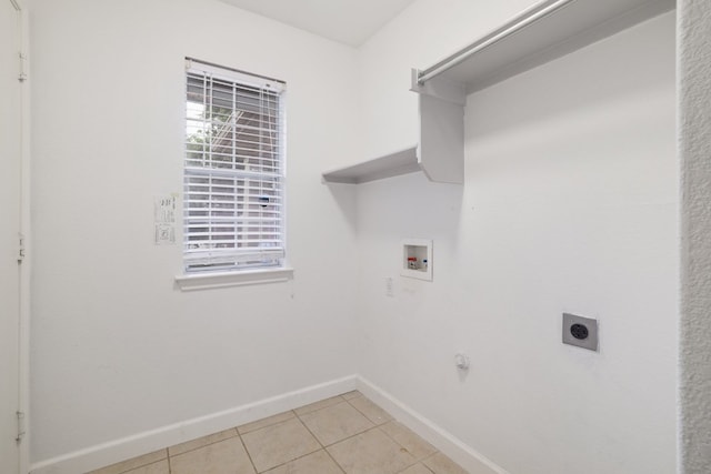 3339 Alexander Valley Cv, Round Rock, TX 78665 - laundry room featuring electric dryer hookup, hookup for a washing machine, light tile patterned floors, and gas dryer hookup