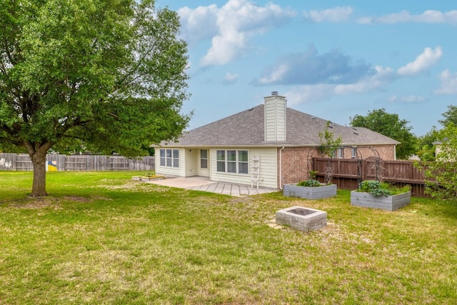 3339 Alexander Valley Cv, Round Rock, TX 78665 - rear view of house featuring a vegetable garden, a fenced backyard, a patio area, a chimney, and brick siding