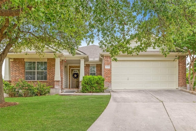 3339 Alexander Valley Cv, Round Rock, TX 78665 - view of front facade featuring brick siding, concrete driveway, a front lawn, an attached garage, and a shingled roof