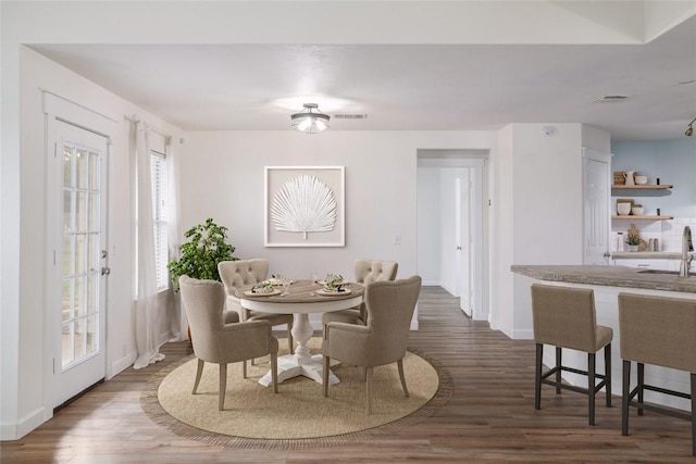 3339 Alexander Valley Cv, Round Rock, TX 78665 - dining space featuring dark wood finished floors and healthy amount of natural light
