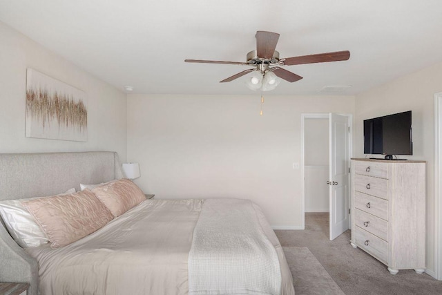 bedroom featuring baseboards, a ceiling fan, and light carpet