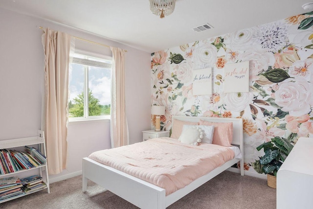 bedroom with baseboards, light colored carpet, and visible vents