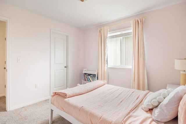 bedroom featuring carpet flooring and baseboards
