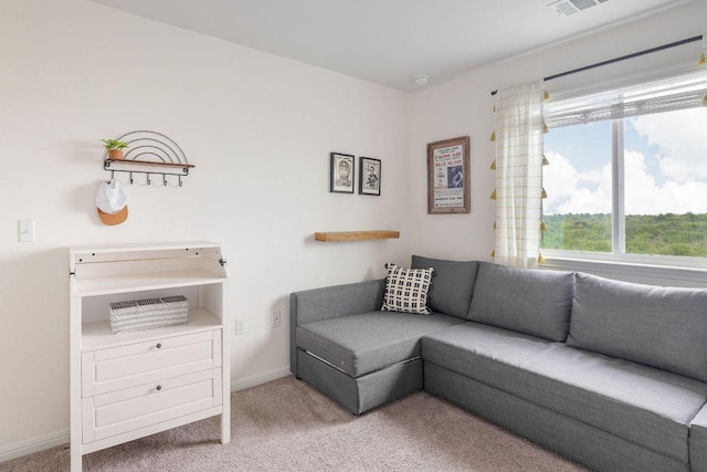 living area with baseboards, carpet, and visible vents