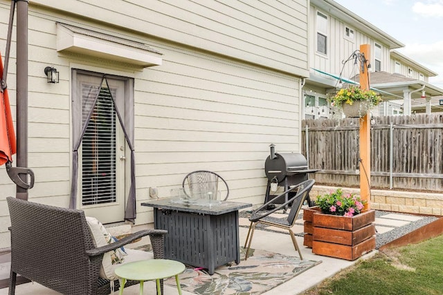view of patio / terrace featuring fence and grilling area