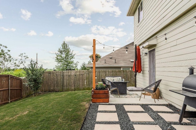 view of yard with a patio and a fenced backyard