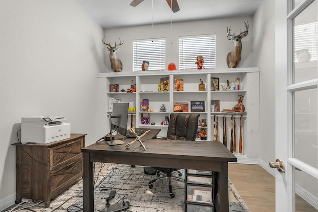 2217 Belen Dr, Leander, TX 78641 - office area with wood finished floors, plenty of natural light, ceiling fan, and baseboards