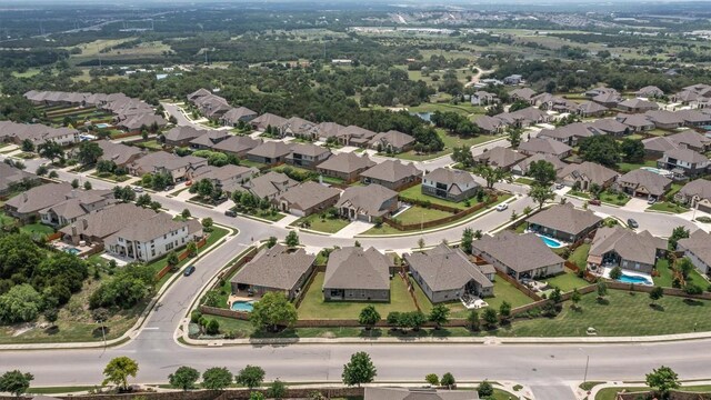 birds eye view of property with a residential view