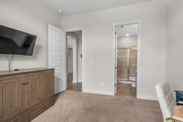 2217 Belen Dr, Leander, TX 78641 - bedroom featuring light carpet, baseboards, and ensuite bathroom