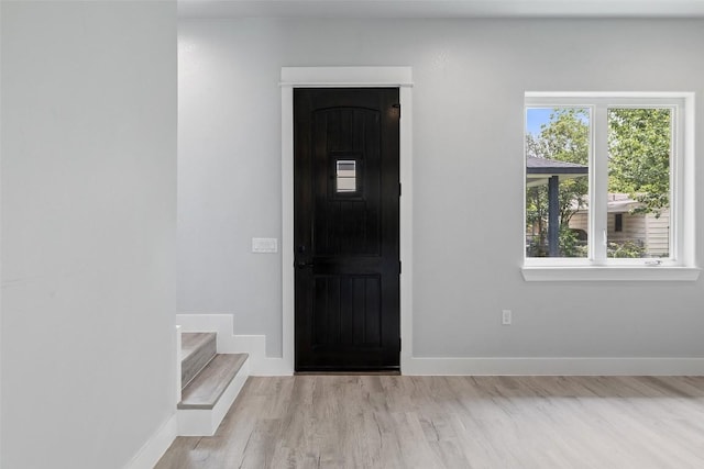 1000B Vargas Rd Unit B, Austin, TX 78741 - foyer featuring baseboards, plenty of natural light, wood finished floors, and stairway