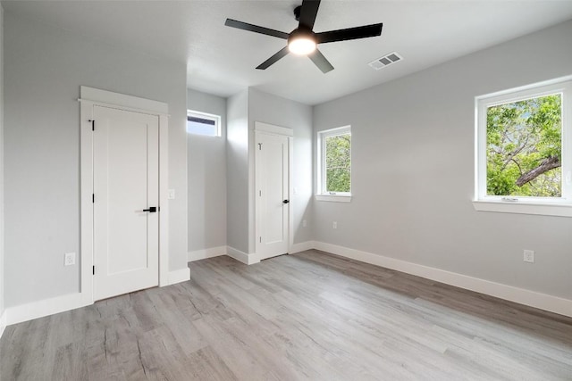 1000B Vargas Rd Unit B, Austin, TX 78741 - unfurnished bedroom with a ceiling fan, baseboards, visible vents, and light wood finished floors