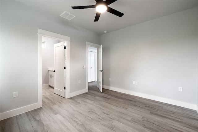 1000B Vargas Rd Unit B, Austin, TX 78741 - unfurnished bedroom with visible vents, a ceiling fan, baseboards, and wood finished floors