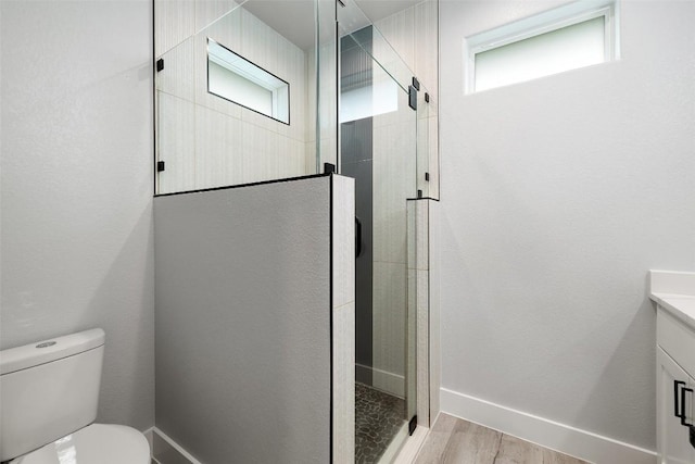 1000B Vargas Rd Unit B, Austin, TX 78741 - full bath featuring vanity, a shower stall, toilet, and wood finished floors