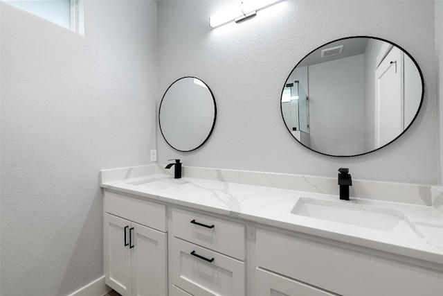 1000B Vargas Rd Unit B, Austin, TX 78741 - bathroom with double vanity, visible vents, and a sink