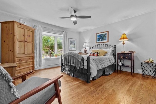 5414 Duval St, Austin, TX 78751 - bedroom featuring light wood-style floors, ceiling fan, and ornamental molding