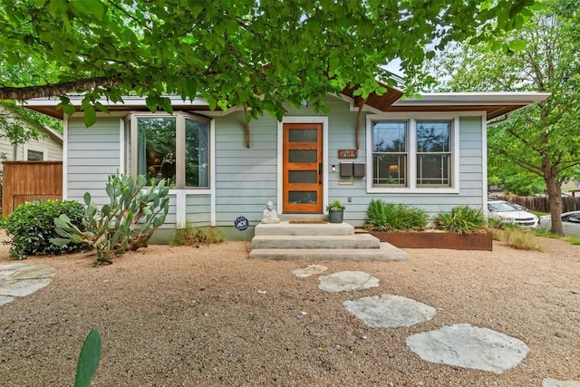 view of front of house featuring fence