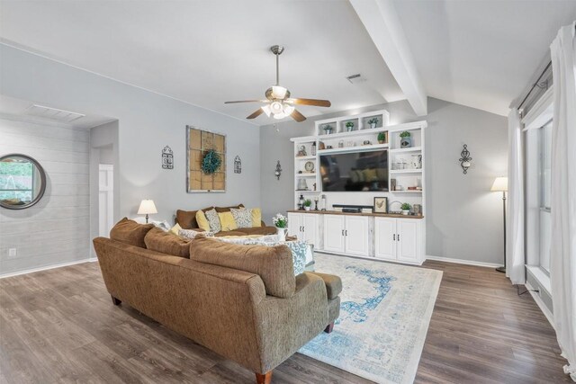living area with ceiling fan, visible vents, and wood finished floors
