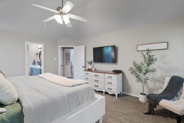 carpeted bedroom with baseboards, ensuite bath, ceiling fan, and lofted ceiling