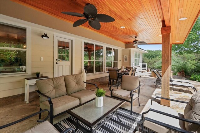 view of patio / terrace with an outdoor living space, outdoor dining area, and ceiling fan