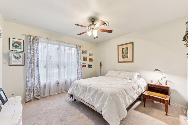 carpeted bedroom featuring a ceiling fan