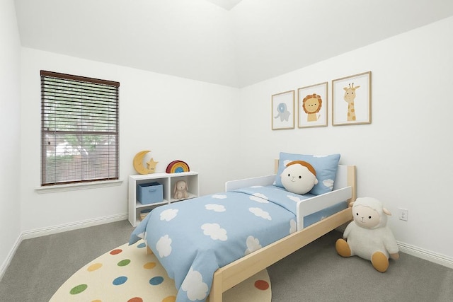 bedroom featuring carpet flooring, baseboards, and lofted ceiling