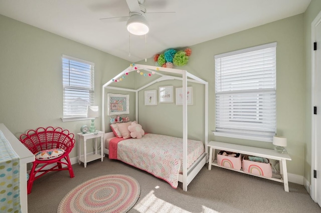 bedroom with carpet floors, baseboards, and a ceiling fan