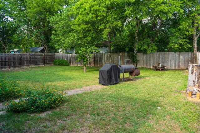 view of yard with a fenced backyard