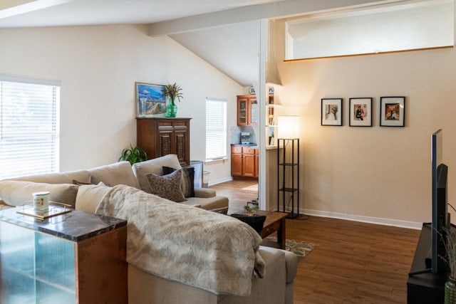 living room with baseboards, vaulted ceiling with beams, dark wood-style flooring, and a wealth of natural light