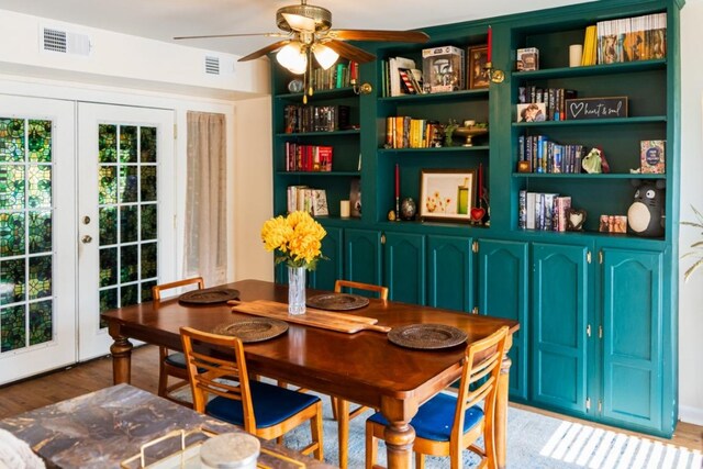 dining space with ceiling fan, visible vents, french doors, and light wood finished floors