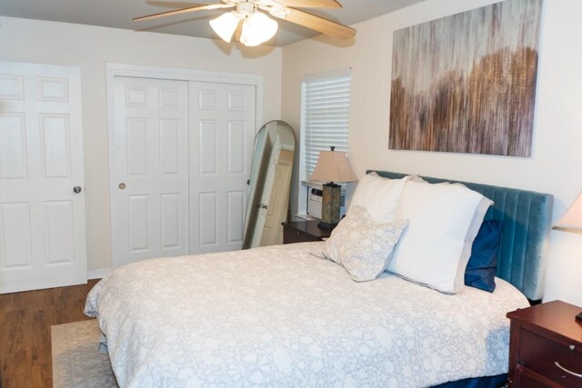 bedroom featuring a ceiling fan, a closet, and wood finished floors