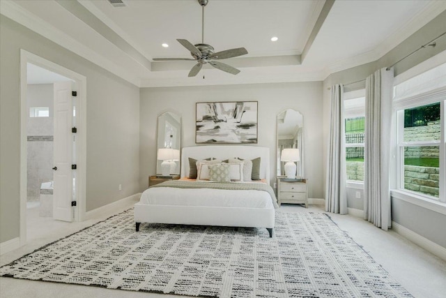 2421 Parisio Ct, Leander, TX 78641 - bedroom featuring baseboards, arched walkways, and a tray ceiling