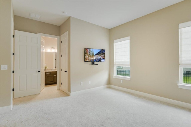 2421 Parisio Ct, Leander, TX 78641 - unfurnished bedroom with light carpet and connected bathroom