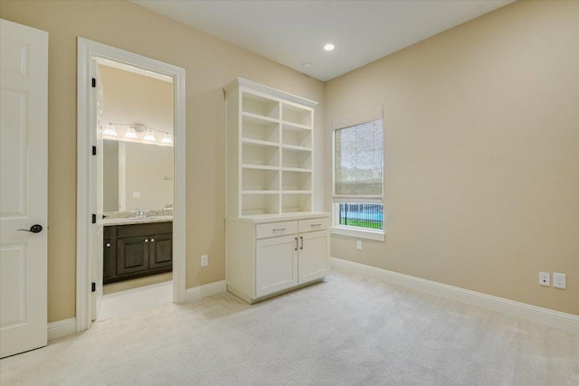 2421 Parisio Ct, Leander, TX 78641 - unfurnished bedroom with baseboards, recessed lighting, connected bathroom, and light carpet