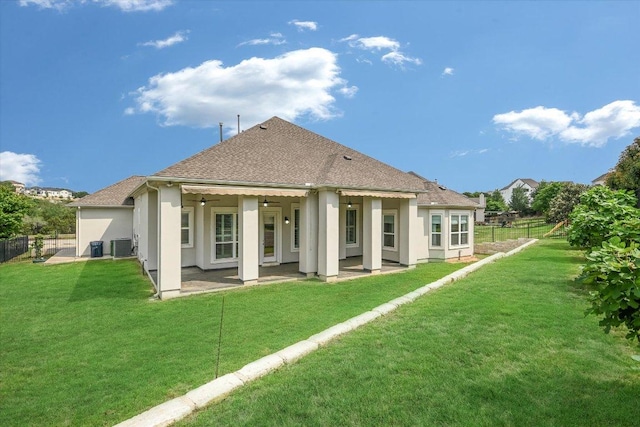 2421 Parisio Ct, Leander, TX 78641 - rear view of property featuring a patio area, roof with shingles, and stucco siding