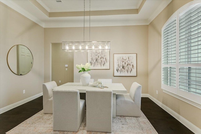 2421 Parisio Ct, Leander, TX 78641 - dining area featuring ornamental molding, wood finished floors, and a tray ceiling