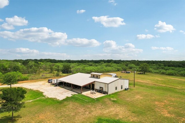 birds eye view of property with a wooded view