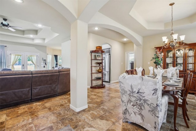 2300 Tumbleweed Trl, Dale, TX 78616 - dining area featuring a raised ceiling, arched walkways, recessed lighting, a chandelier, and ceiling fan