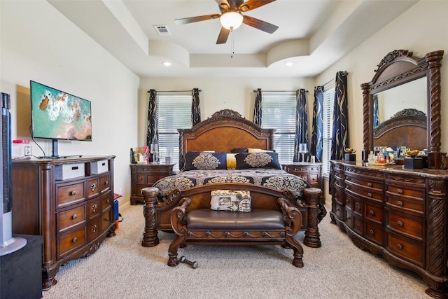 2300 Tumbleweed Trl, Dale, TX 78616 - bedroom featuring light carpet, a tray ceiling, a ceiling fan, and recessed lighting