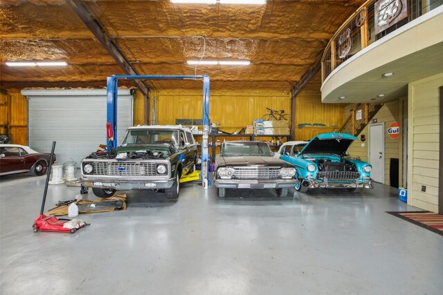 garage featuring wooden walls