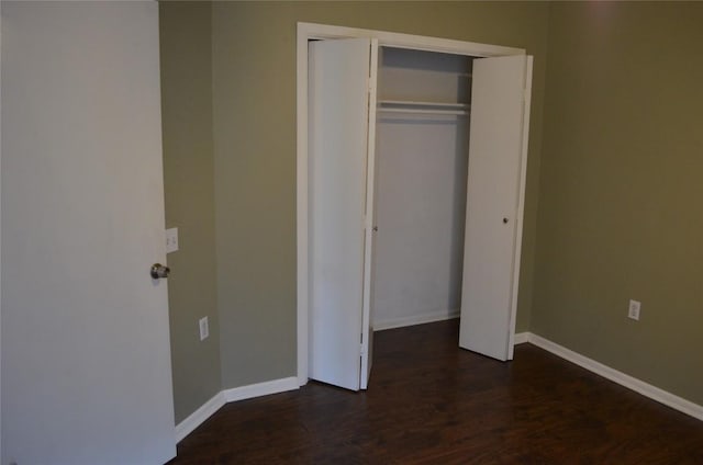 5009 Lott Ave, Austin, TX 78721 - unfurnished bedroom with dark wood-style floors and a closet