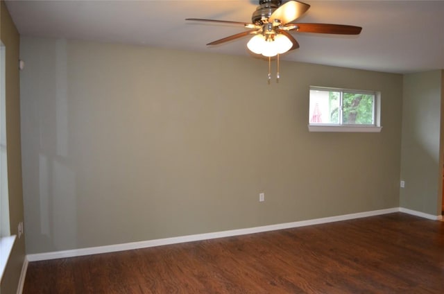5009 Lott Ave, Austin, TX 78721 - spare room with dark wood-style floors, ceiling fan, and baseboards